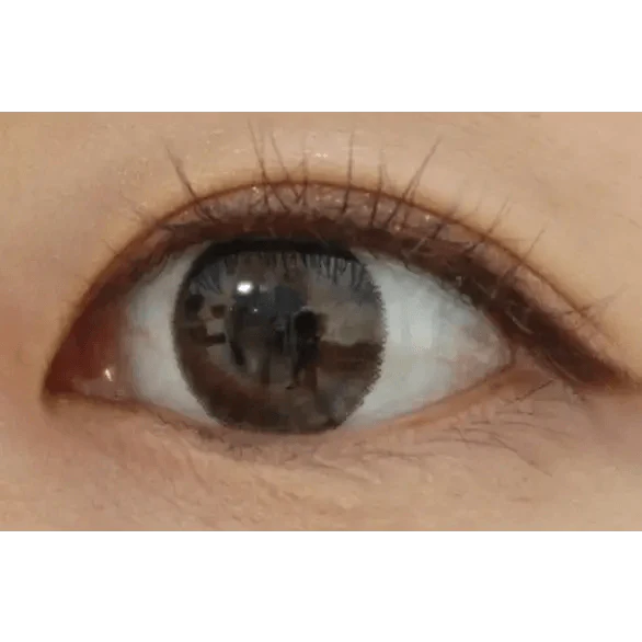 LensTown Not Bad Brown — single-eye close-up showing the contact lens appearance