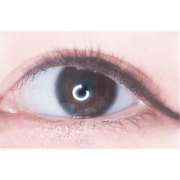 LensTown Nudy Coco Black (10p) — single-eye close-up showing the contact lens appearance
