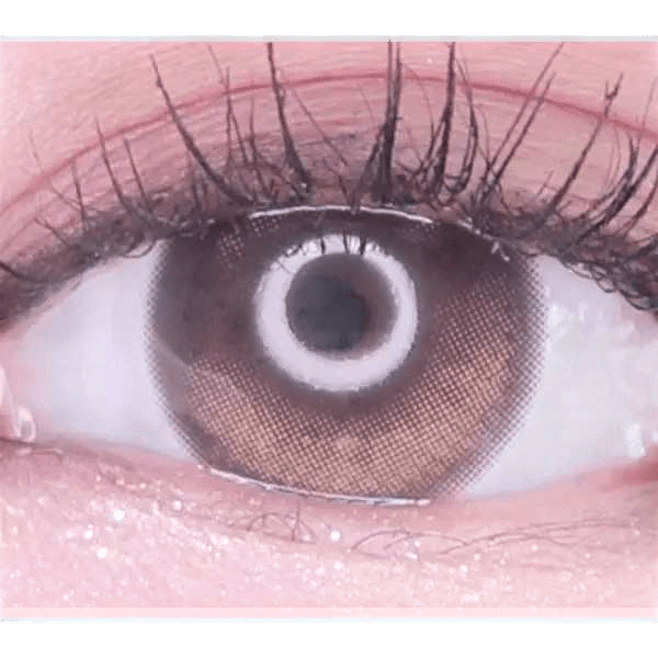 Olens Eyelighter Glowy Brown — single-eye close-up showing the contact lens appearance