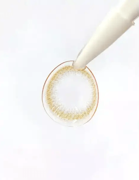 LensTown 17Again Brown — contact lens held with tweezers