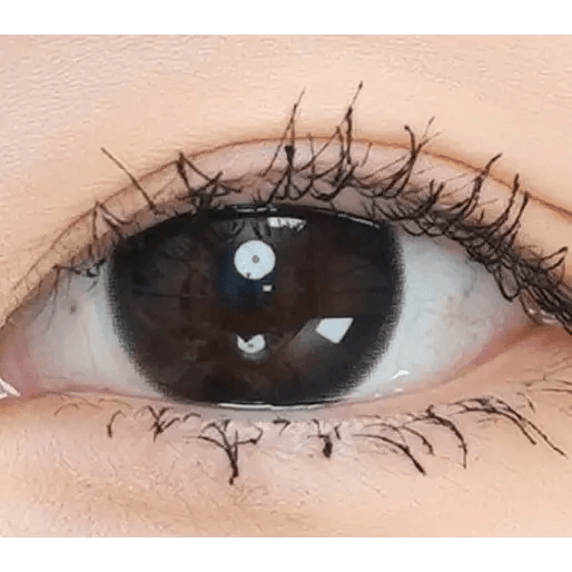Olens And Black — single-eye close-up showing the contact lens appearance