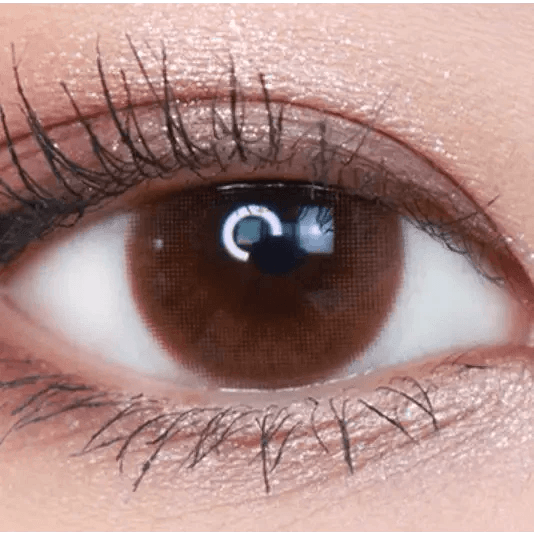 Olens Falling Brown — single-eye close-up showing the contact lens appearance