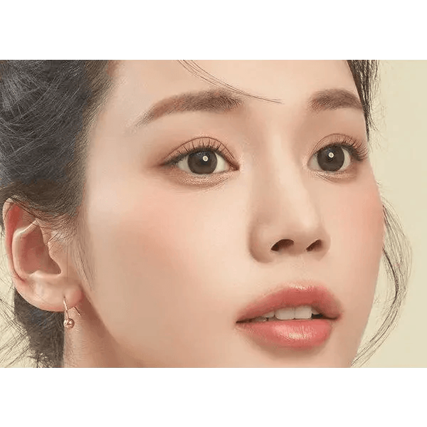 LensTown It's Natural Forest Green — model portrait showing the contact lens look