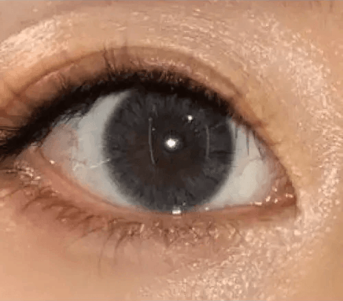 Olens Maybe Gray — single-eye close-up showing the contact lens appearance