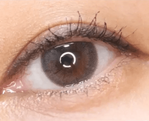 Olens ShineB Gray — single-eye close-up showing the contact lens appearance