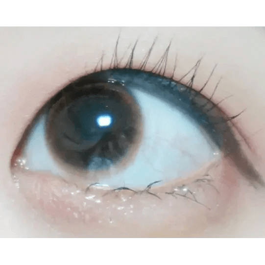Olens Spring Rain Brown — single-eye close-up showing the contact lens appearance