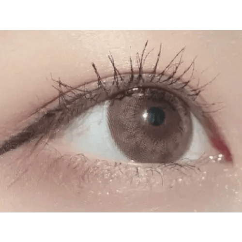 Olens Tika Chocolate Brown — single-eye close-up showing the contact lens appearance