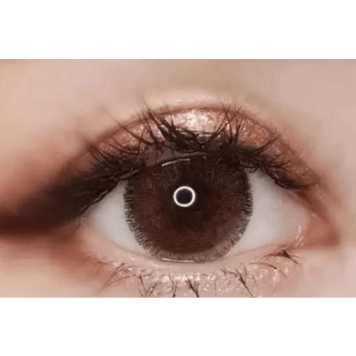 Olens Rich Brown — single-eye close-up showing the contact lens appearance