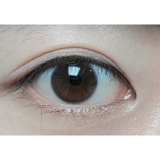 LensTown Rose Swan Brown Topaz — single-eye close-up showing the contact lens appearance