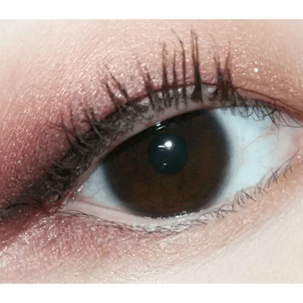 Olens Pusfine Clear — single-eye close-up showing the contact lens appearance