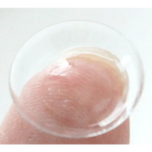 Olens Pusfine Clear — contact lens held on a fingertip