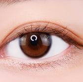 i-DOL Yurial Water Brown — single-eye close-up showing the contact lens appearance