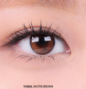 i-DOL Yurial Water Brown — single-eye close-up showing the contact lens appearance