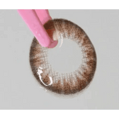 LensTown Back to Basic Street Ash Brown — contact lens held with tweezers