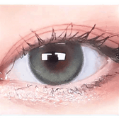 Olens Eyelighter Glowy Ash Gray — single-eye close-up showing the contact lens appearance