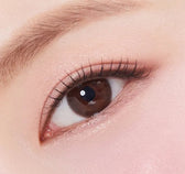 Olens Falling Choco — single-eye close-up showing the contact lens appearance