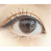 Olens Monet Brown — single-eye close-up showing the contact lens appearance
