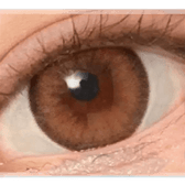 Olens Nils Brown — single-eye close-up showing the contact lens appearance