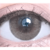 Olens Nils Brown — single-eye close-up showing the contact lens appearance