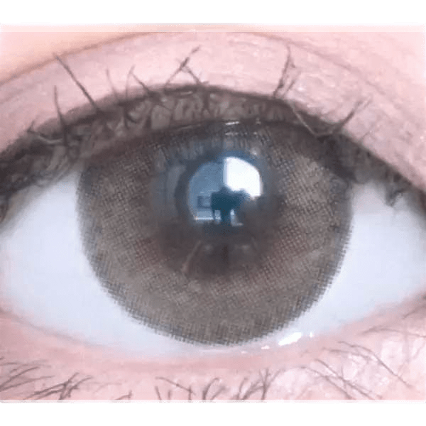 Olens Nils Brown — single-eye close-up showing the contact lens appearance