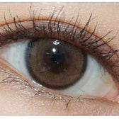 Olens Real Ring Brown — single-eye close-up showing the contact lens appearance