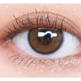 Olens Real Ring Brown — single-eye close-up showing the contact lens appearance