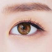 LensTown 247 With Me Olive (10p) — single-eye close-up showing the contact lens appearance