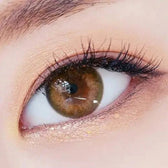LensTown 247 With Me Olive (10p) — single-eye close-up showing the contact lens appearance