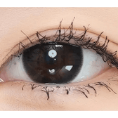Olens And Black — single-eye close-up showing the contact lens appearance
