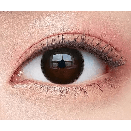 Olens And Black — single-eye close-up showing the contact lens appearance