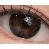 Olens And Black — single-eye close-up showing the contact lens appearance