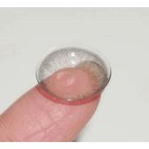 LensTown Back to Basic Avenue Gray — contact lens held on a fingertip