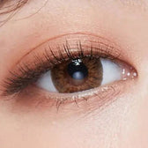 LensTown Back to Basic July Brown — single-eye close-up showing the contact lens appearance