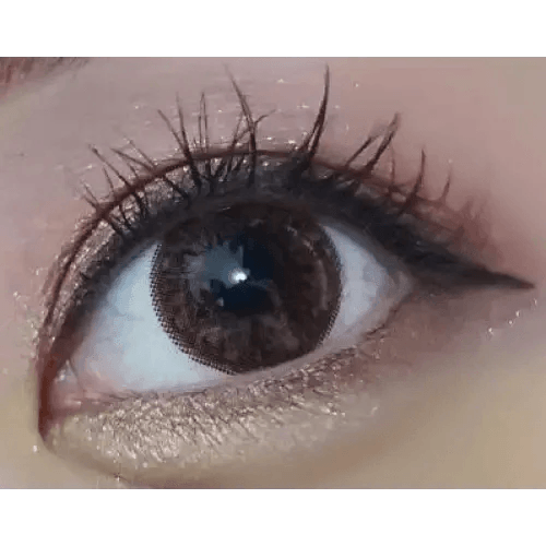 Olens Big Grang Grang Brown — single-eye close-up showing the contact lens appearance