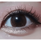 Olens Big Grang Grang Brown — single-eye close-up showing the contact lens appearance