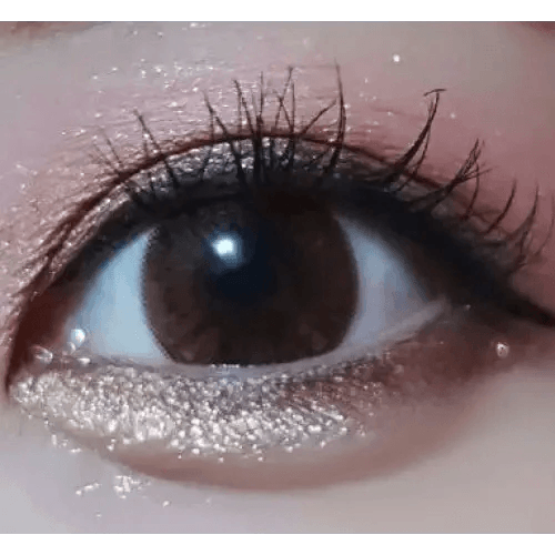 Olens Big Grang Grang Brown — single-eye close-up showing the contact lens appearance