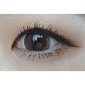 Olens Big Grang Grang Brown — single-eye close-up showing the contact lens appearance