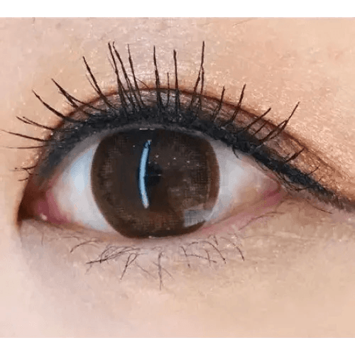 Olens BS 21 Brown — single-eye close-up showing the contact lens appearance
