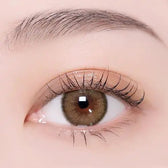 i-DOL Canna Roze Beige Brown — single-eye close-up showing the contact lens appearance
