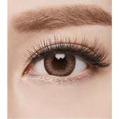 Olens Chandelier Brown — single-eye close-up showing the contact lens appearance