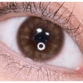 Olens EyeTeen Brown — single-eye close-up showing the contact lens appearance