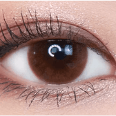 Olens Falling Brown — single-eye close-up showing the contact lens appearance