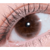 Olens Falling Brown — single-eye close-up showing the contact lens appearance