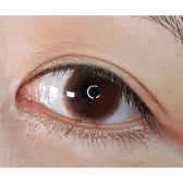 Olens Falling Brown — single-eye close-up showing the contact lens appearance