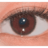 LensVery Funny Ann Sweet Wine Violet — single-eye close-up showing the contact lens appearance