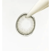 LensTown Hermera Gray — contact lens held with an applicator