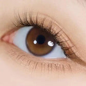 i-DOL Yurial Serum Brown — single-eye close-up showing the contact lens appearance