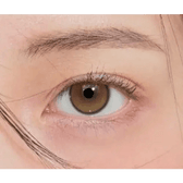 i-DOL Yurial Serum Brown — single-eye close-up showing the contact lens appearance