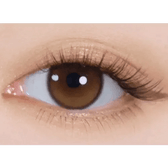 i-DOL Yurial Serum Brown — single-eye close-up showing the contact lens appearance
