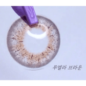 LensRang iWWi Puella Brown — contact lens held with tweezers